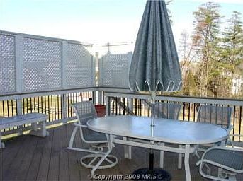 Deck overlooking spacious yard and trees