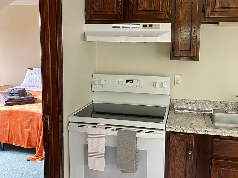 Kitchen with full stove & oven