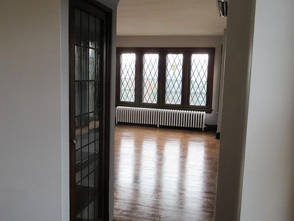 China cabinet in archway between living room and dining room