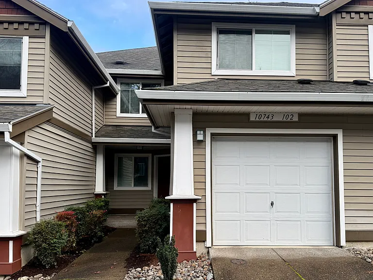 Entrance. Above garage is the larger second bedroom. Above front door is the smaller third bedroom.