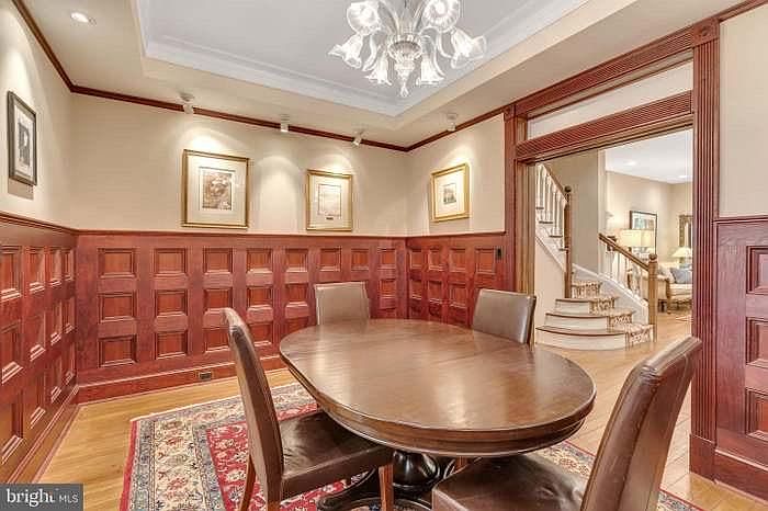 Dining room with custom millwork, hand made chandelier and built in buffet.