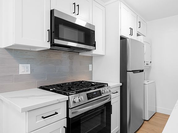 Gas Stove, Microwave, Fridge, Washer/Dryer. New Cabinets , Counters and Backsplash.