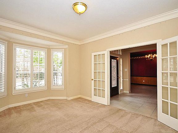 The study has French Doors and a wall of bay windows that further enhances the size of the room.