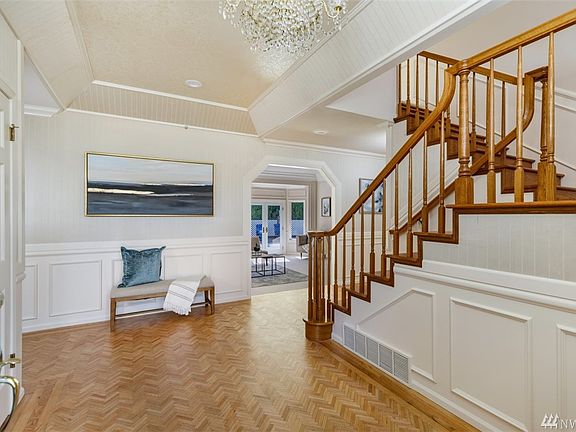 Formal double door entry with oak flooring
