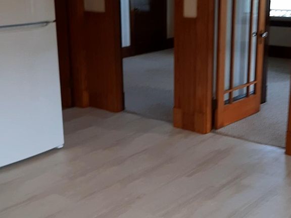 Kitchen looking into living rooms with French doors.