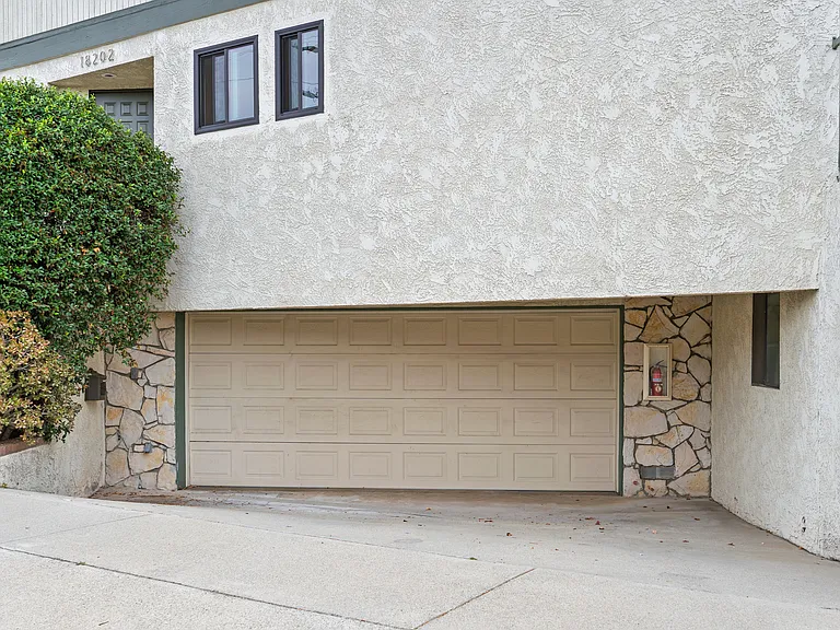 Private driveway and garage with its own access to the home