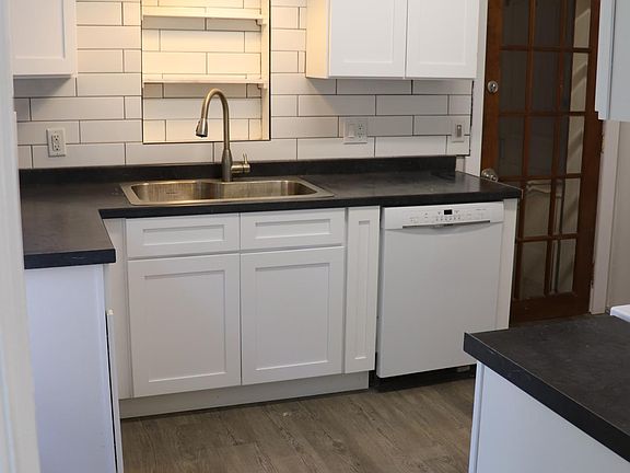 brand new upgraded kitchen. new cabinets. new sink. new countertop. new floors.