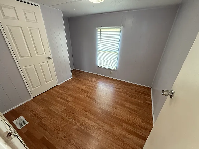 First bedroom. New paint and flooring.