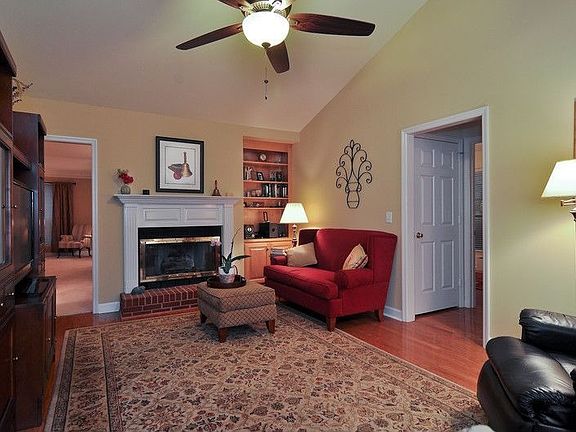 Den with vaulted ceiling