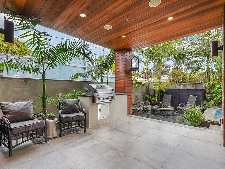 Covered patio off the kitchen features gas BBQ and Sonos speakers