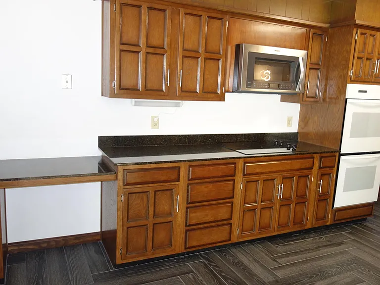 Other side of kitchen w/desk area