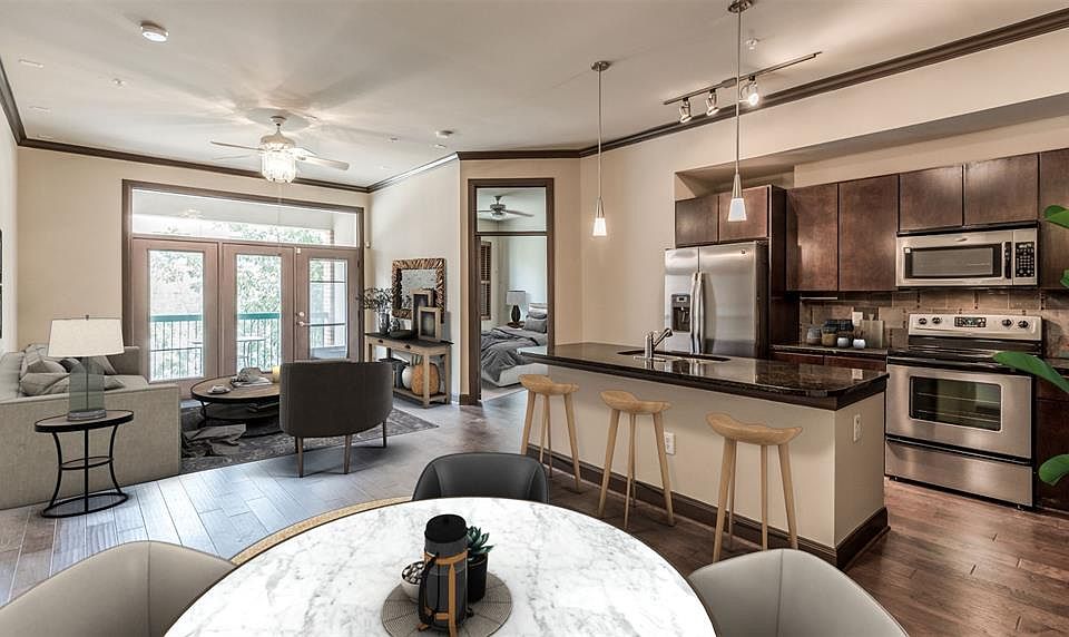 This photo has been virtually staged. Spacious 2 bedroom 2 bath unit with a private balcony located in the heart of vibrant Midtown! New hardwood floors! Kitchen features great storage, granite countertops, back splash, & SS appliances.
