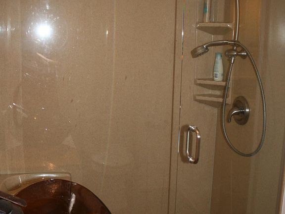 Bathroom -Larger glass shower with seat.