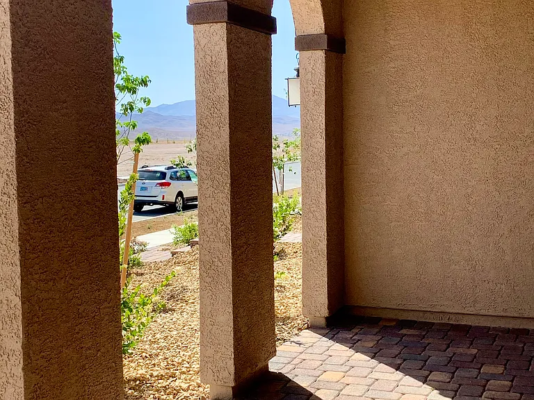 Spacious front porch with mountain view
