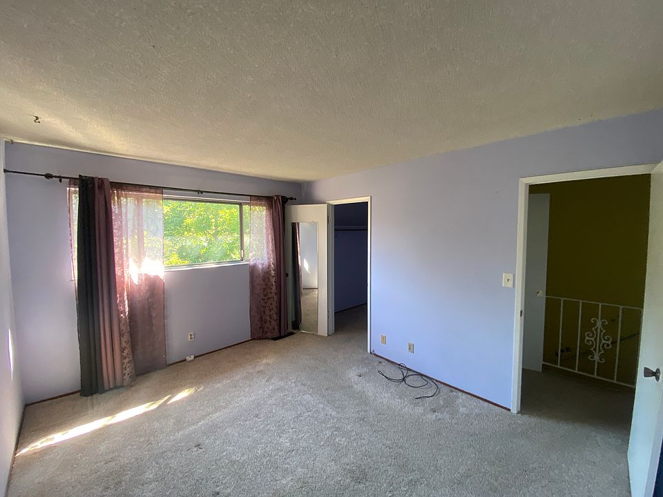 master bedroom with walk in closet. in process of being repainted
