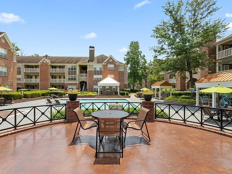 Elegant Outdoor Poolside Deck with Tables