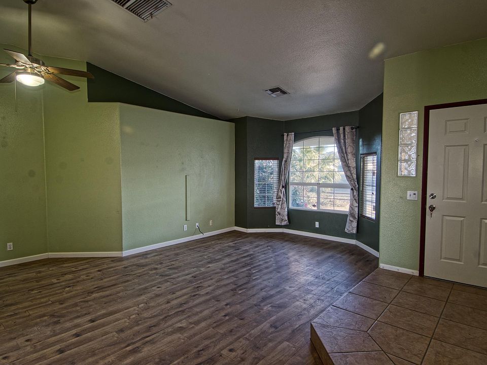 Living room has tile entry and laminate floor.