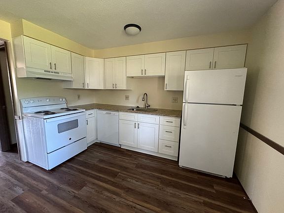 New cabinets, new stove, new dishwasher and fridge in kitchen in back of unit