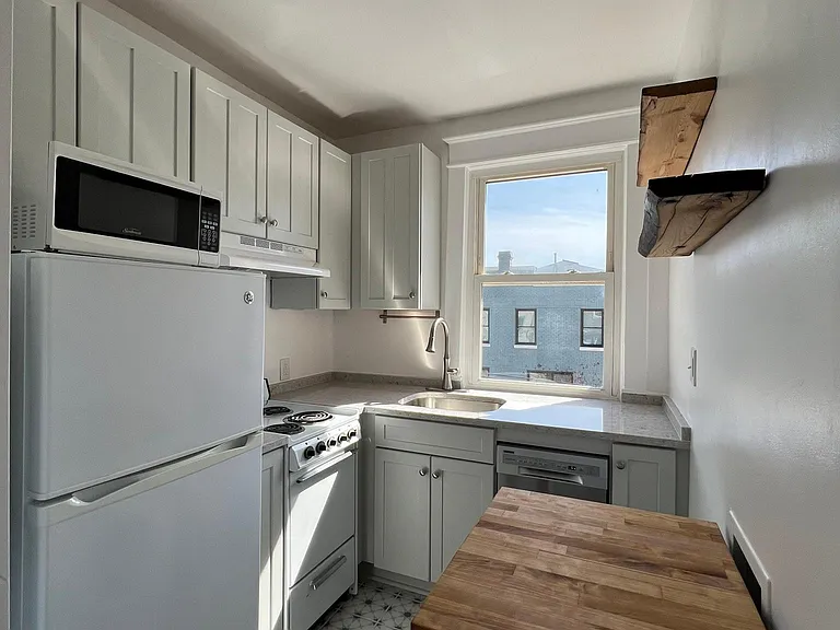 Kitchen - wooden shelves on left