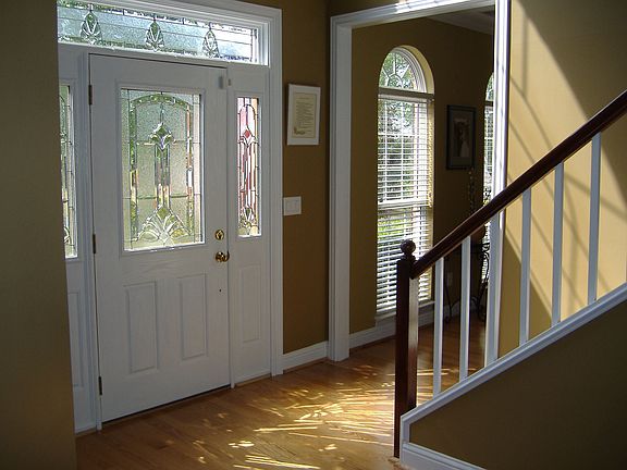 New entranceway with gleaming hardwood floors