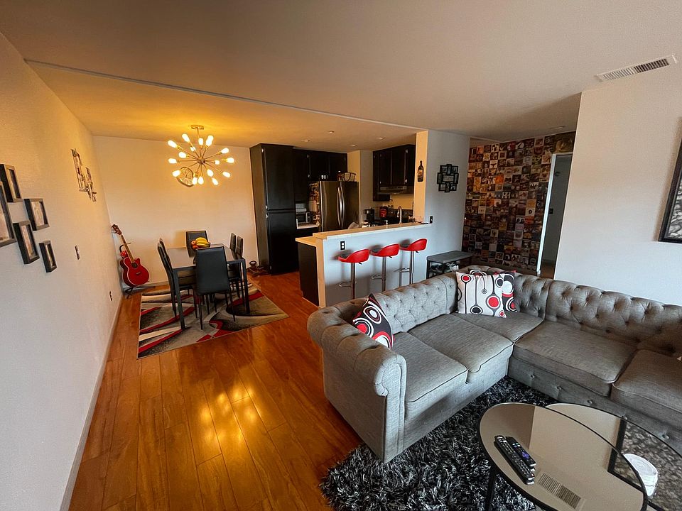 Living Room/Dining Room with couch and six person dining room table for room size reference