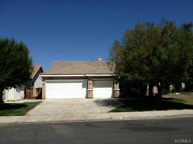 Spacious 3 car garage. The mature shade trees keep the front liv