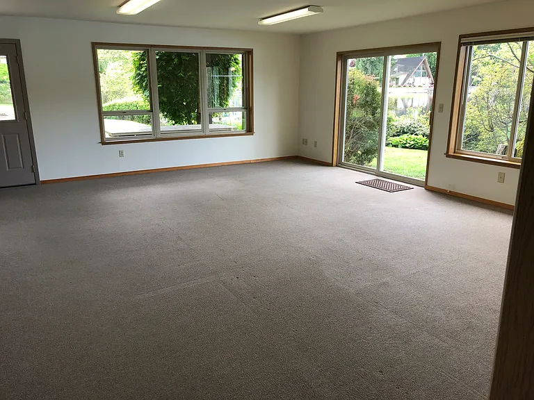 Living Room - the main entry (double doors) are partially visible at left.