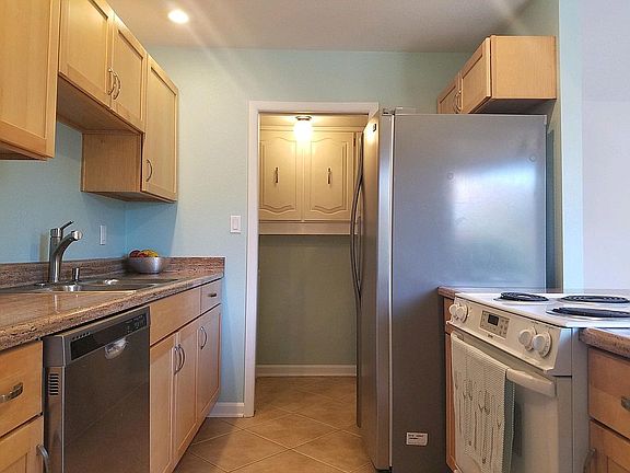 Get your gourmet on in here. :) Laundry room is through the doorway at the end.