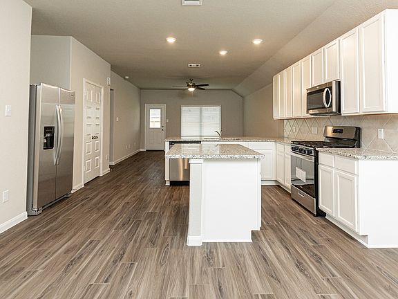 Dining Area to Kitchen and Family Room