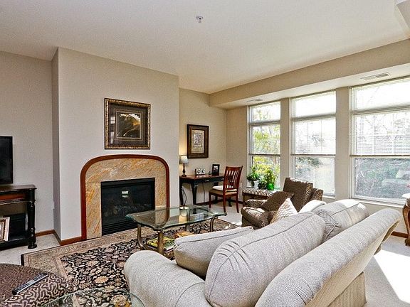 Living Room with fireplace and creek views
