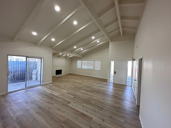 Large family room and dining room with high ceiling