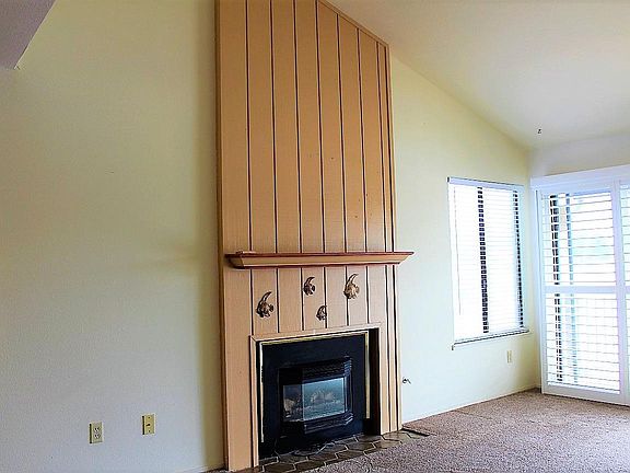 Living Room includes fireplace to warm up on chilly nights.