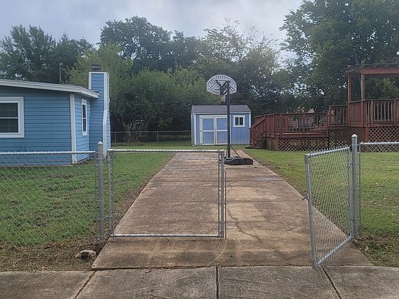 Backyard driveway 3 could be used to park Rv or perfect when it's wet outside to barbecue or just relax