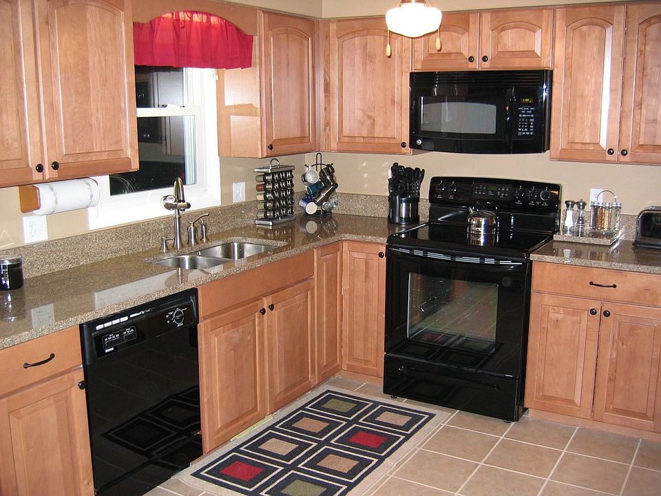 new maple cabinets, granite, appliances, and ceramic floor.