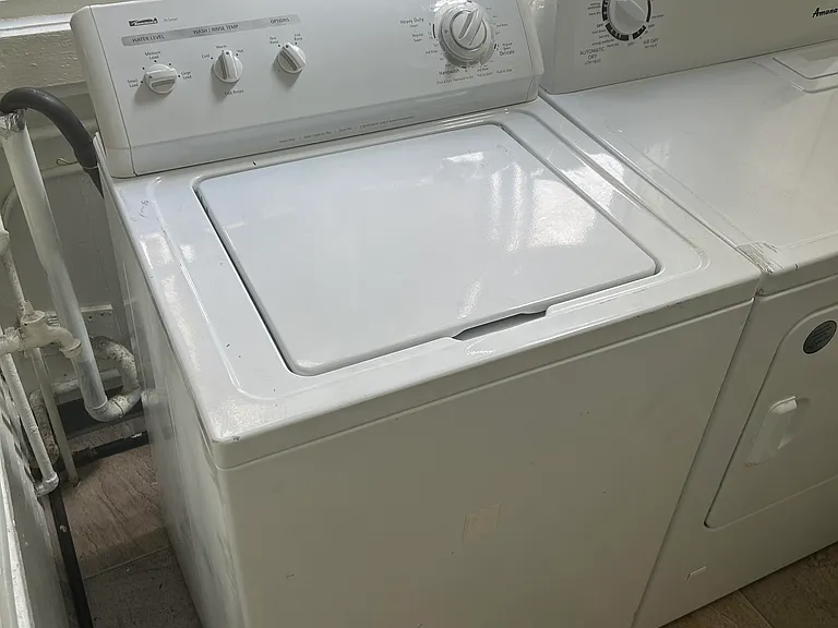 washer and dryer are in a room off the kitchen