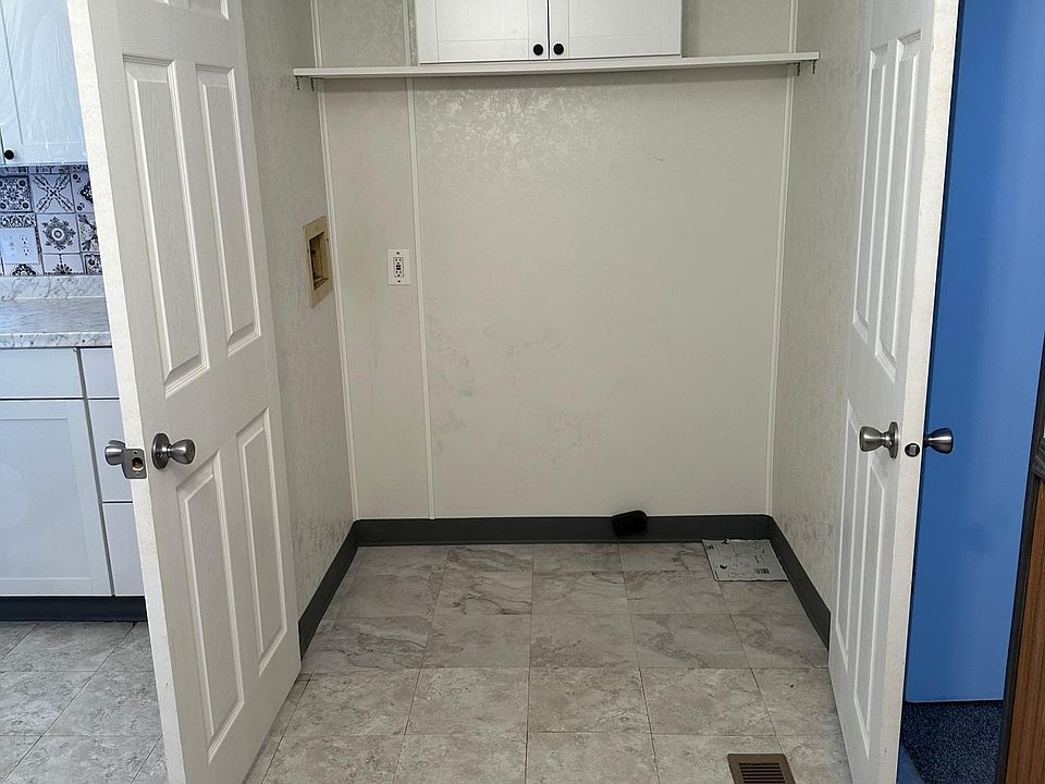 Washer/Dryer area behind closed doors