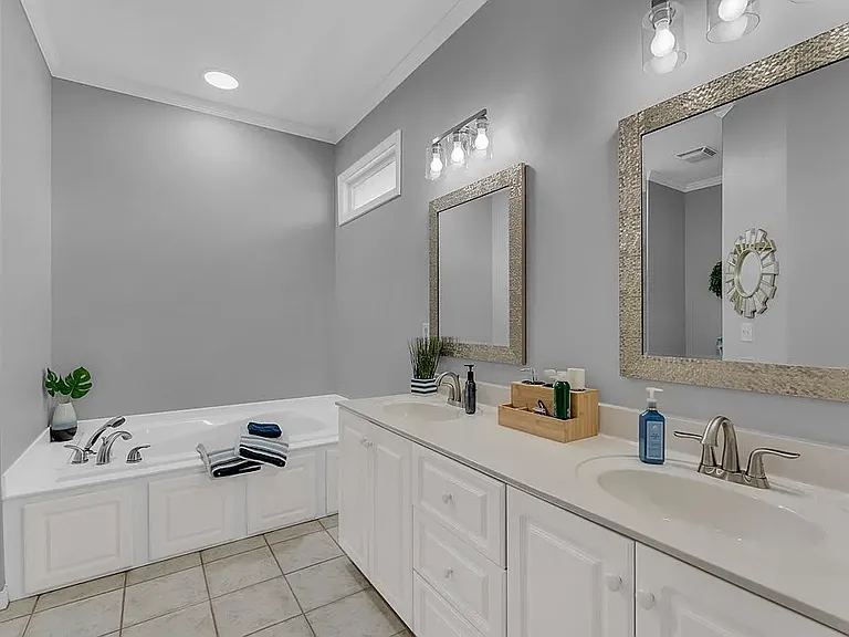 Master Bedroom restroom. Not shown is a linen closet on the right and a walk in closet on the left.
