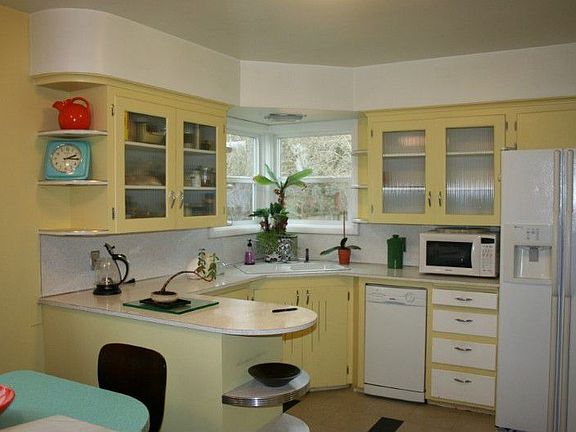 Fresh paint and new vinyl windows give the kitchen a crisp, light and bright feel.