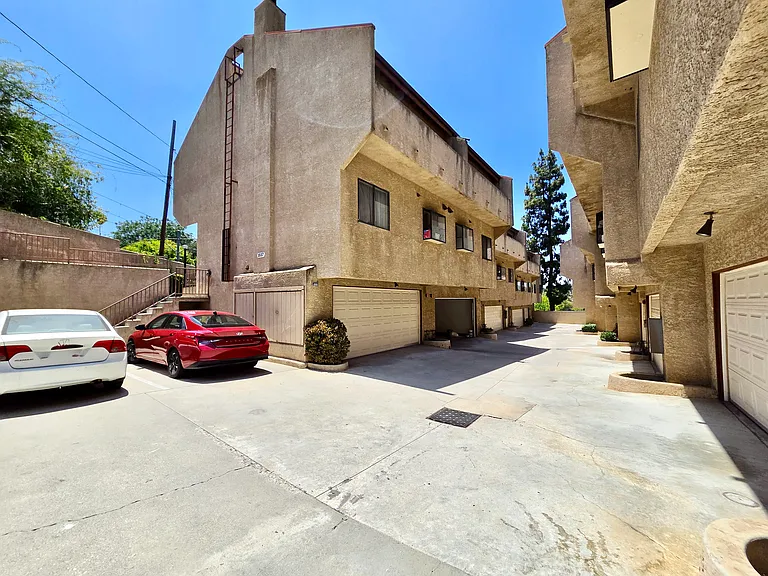 Back units offering privacy from the street. Large shared driveway between garages, 7 first-come, first-served parking spaces for occupants and guests. Plenty of easy street parking.