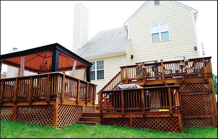 Tri-level deck in fenced in back yard