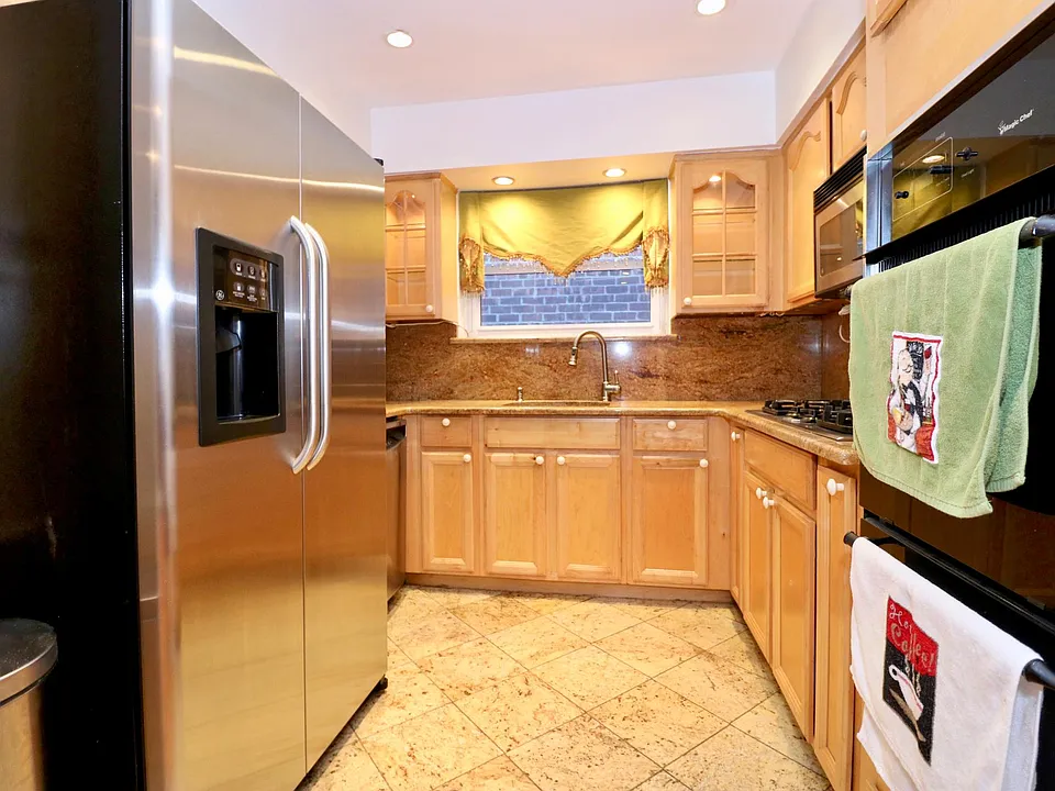 Stainless Steel Appliances, beautiful tiled floors (easy to clean) with granite backsplash.