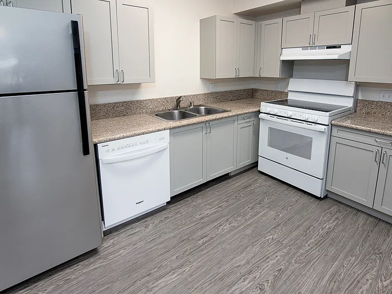 Kitchen with modern appliances and ample cabinet space.