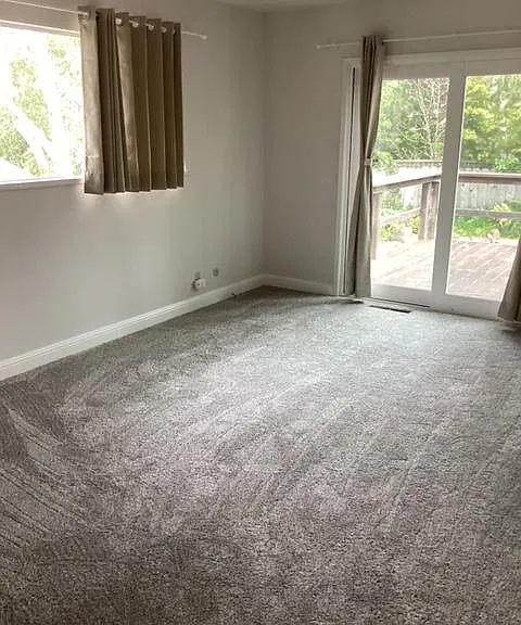 Master bedroom. Carpeted. Slider access to deck. Natural light.