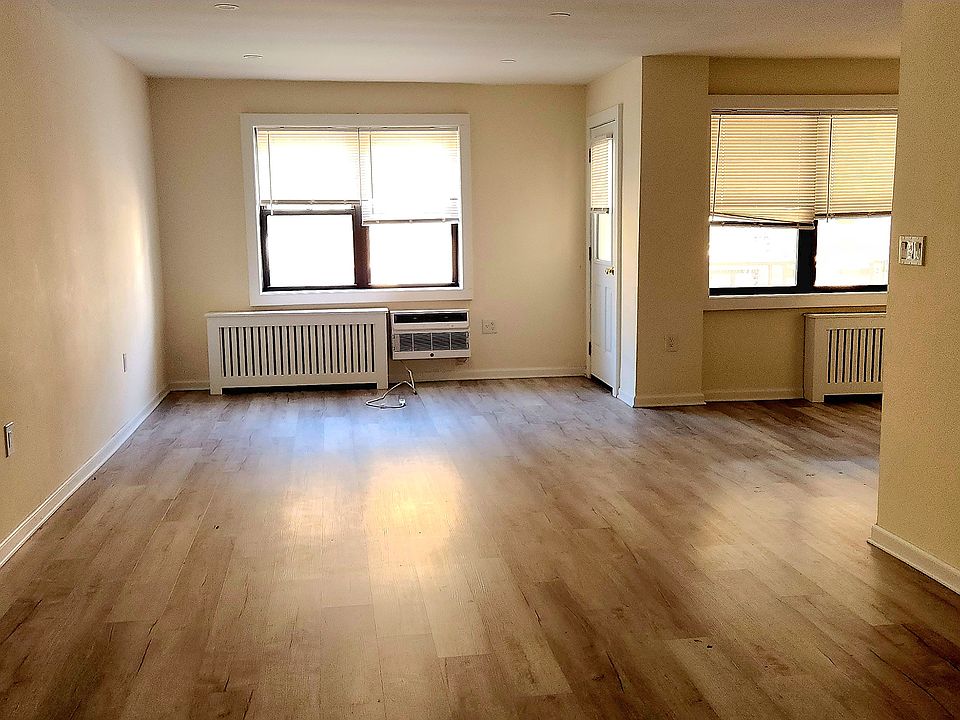 Beautiful bright living room/ding room with new flooring.