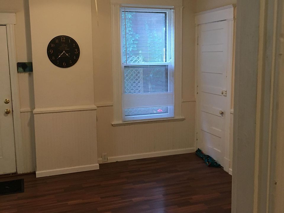 Livingroom 15x15. Enters off back-private entry. door on far right leads to hallway with entry to basement. Walkway to rear entrance is fully lit.