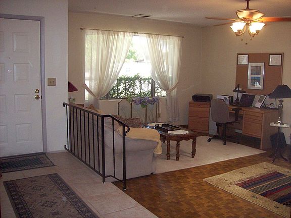 Sunken living room with large picture window for sunshine