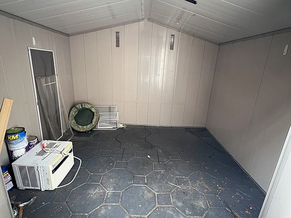 Spacious shed that has a key lock.