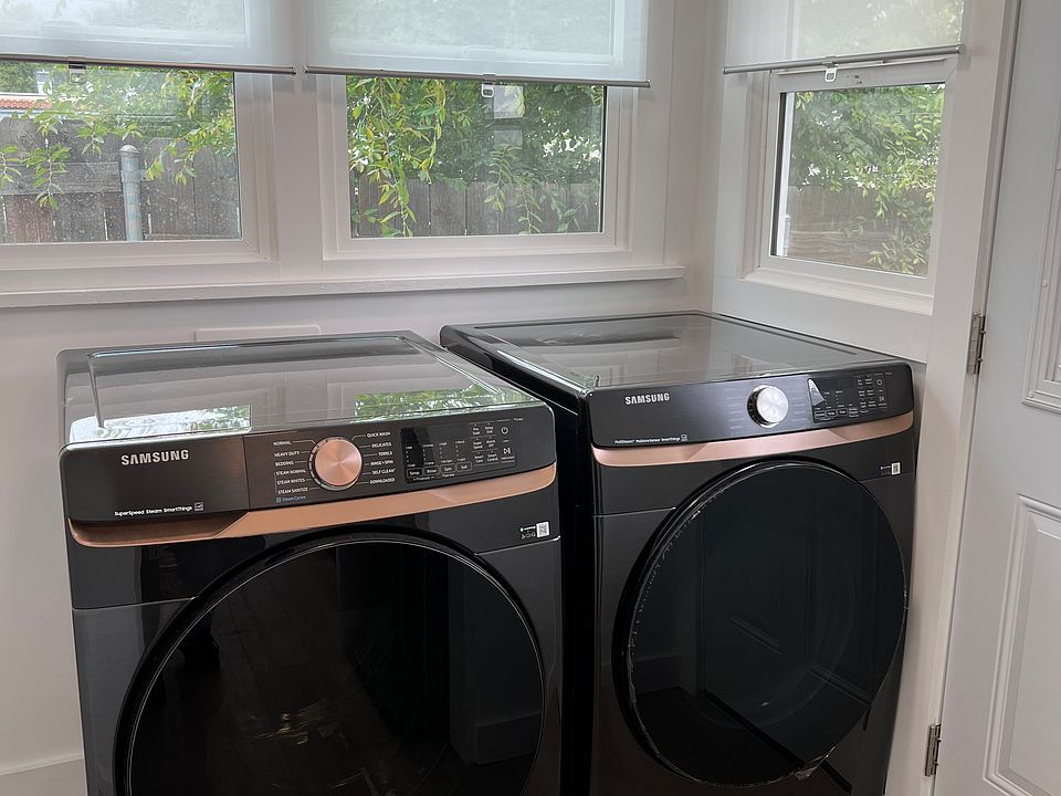 Laundry Area with New Appliances, back door leads to your parking space.