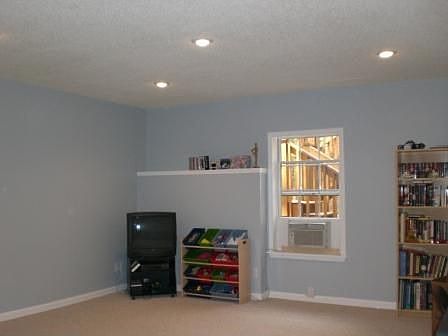 Perfect for media or rec room. high ceilings, recessed lighting.  Office nook.