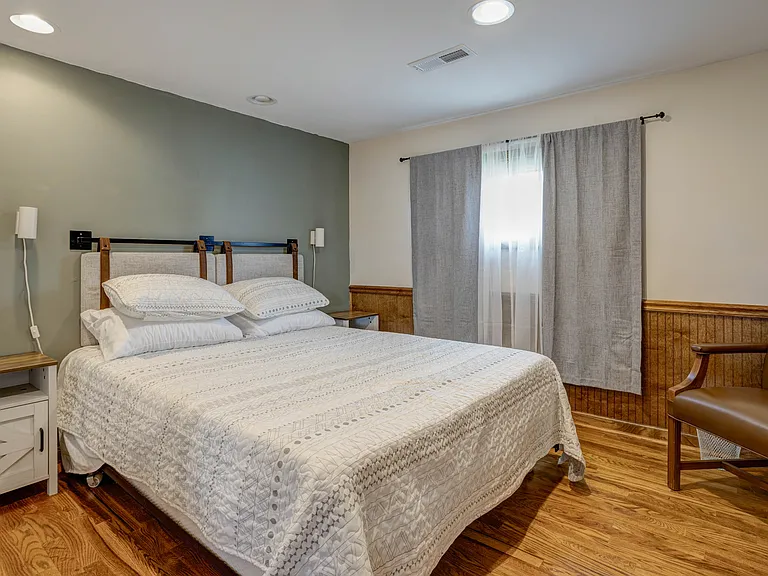 Bedroom is 10x10, pictured with a queen sized bed.